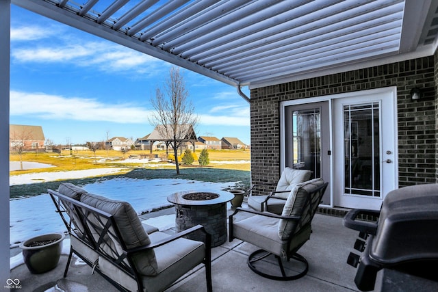 view of patio featuring area for grilling and a fire pit