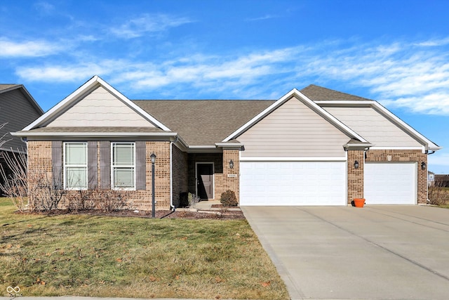 view of front of house featuring a garage and a front yard