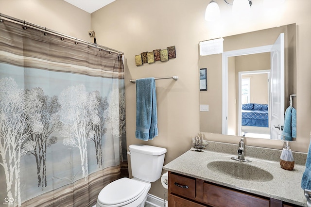 bathroom with vanity, a shower with curtain, and toilet