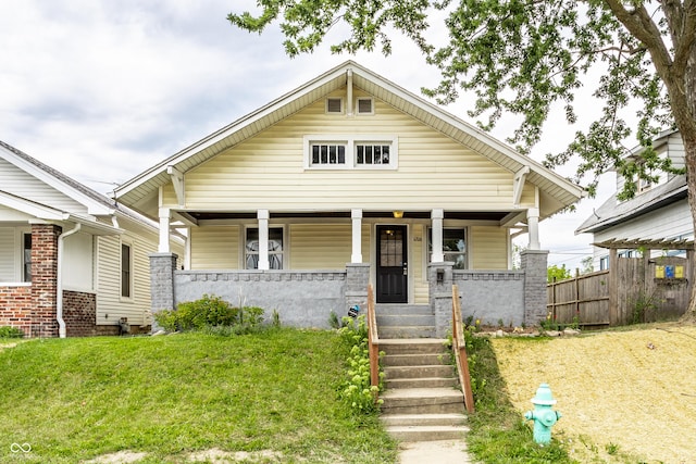 view of front facade with a porch and a front yard