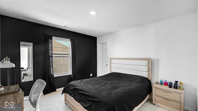 bedroom featuring light carpet