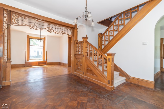 stairs featuring parquet floors