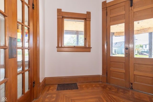 doorway featuring parquet flooring and french doors