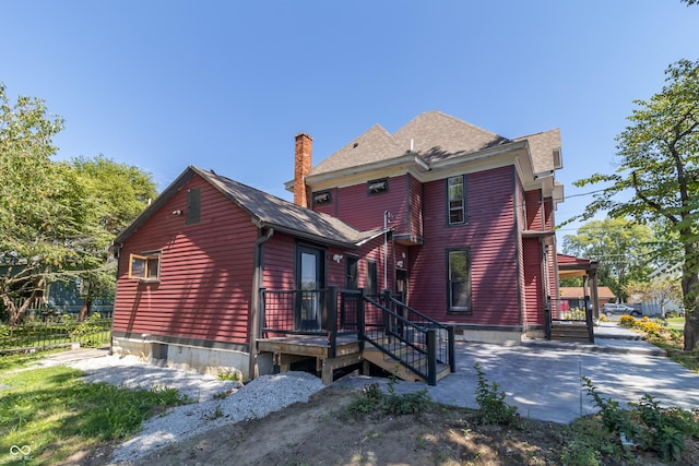 back of property featuring a patio