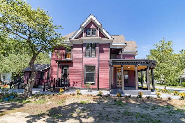 victorian house featuring covered porch