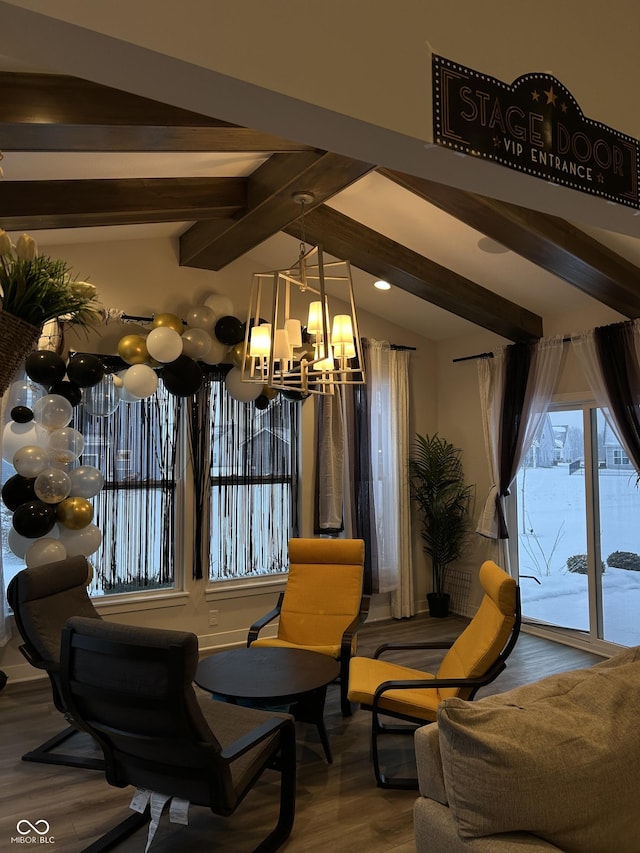 living area featuring hardwood / wood-style flooring, a chandelier, and vaulted ceiling with beams