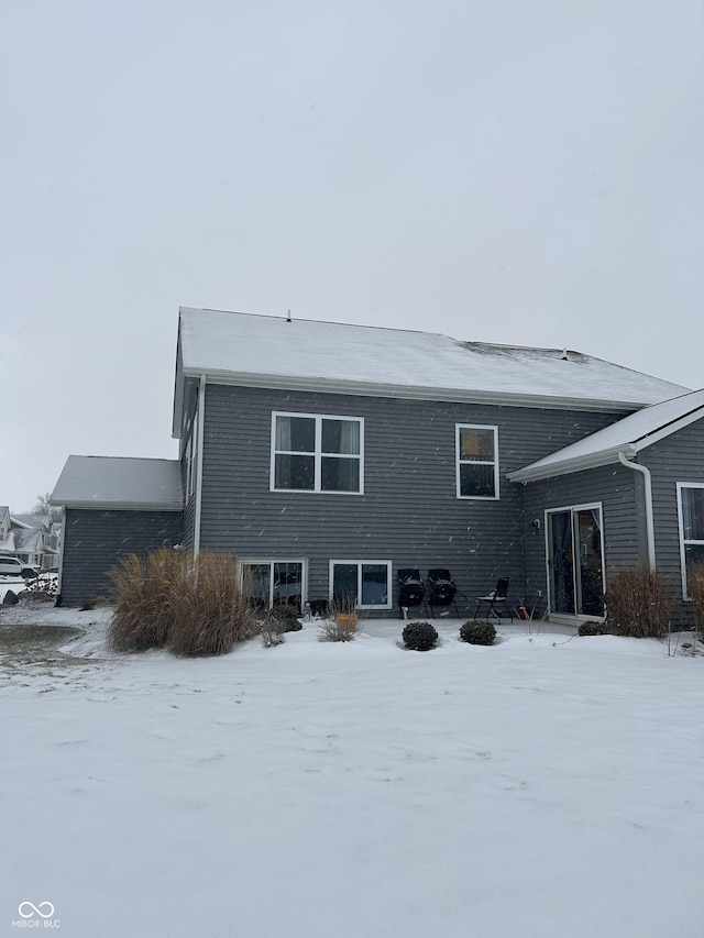 view of snow covered house