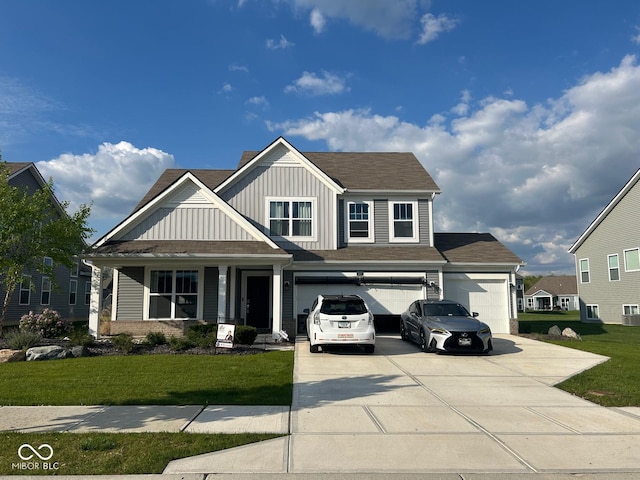9426 Orchard Cove Dr, Indianapolis, IN 46239 - view of front of property with board and batten siding, concrete driveway, a front lawn, and an attached garage