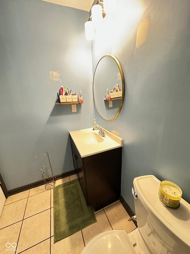 bathroom featuring vanity, toilet, and tile patterned flooring