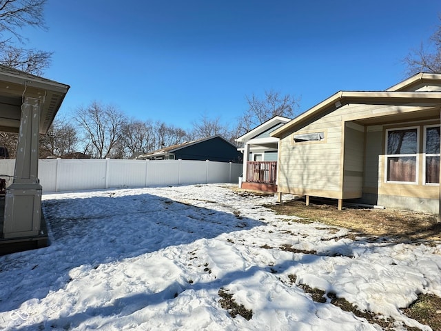 view of yard covered in snow