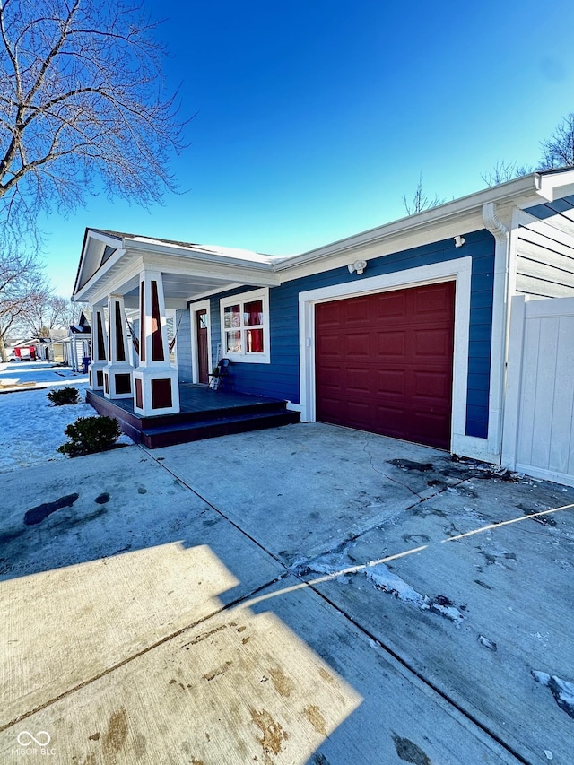 view of front of home with a garage and covered porch