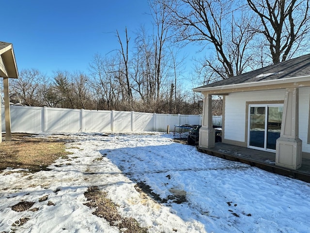 view of yard layered in snow