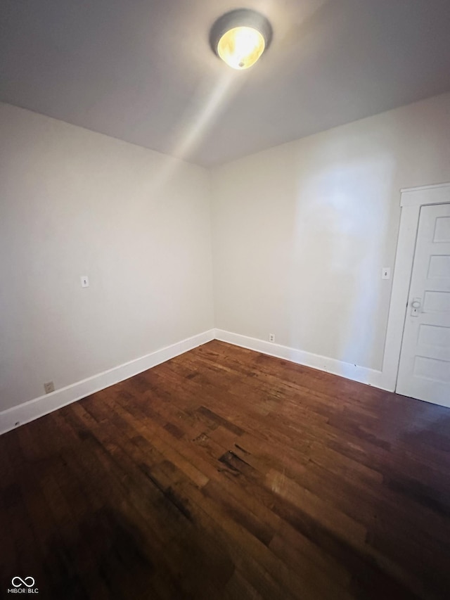 additional living space featuring dark hardwood / wood-style flooring