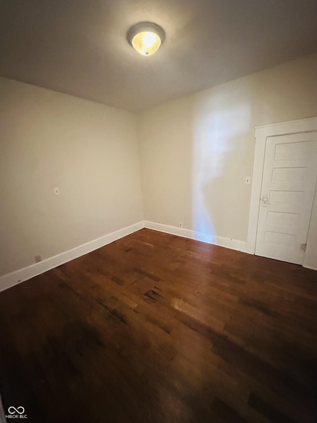 empty room with hardwood / wood-style floors