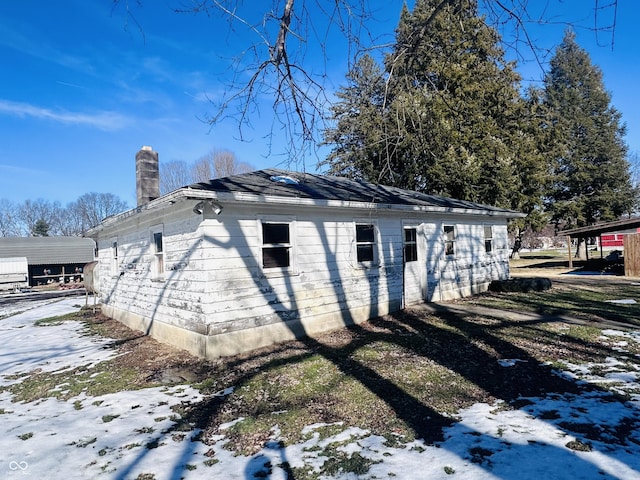 view of snow covered property