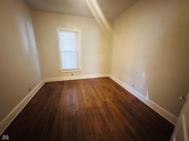 additional living space with dark wood-type flooring