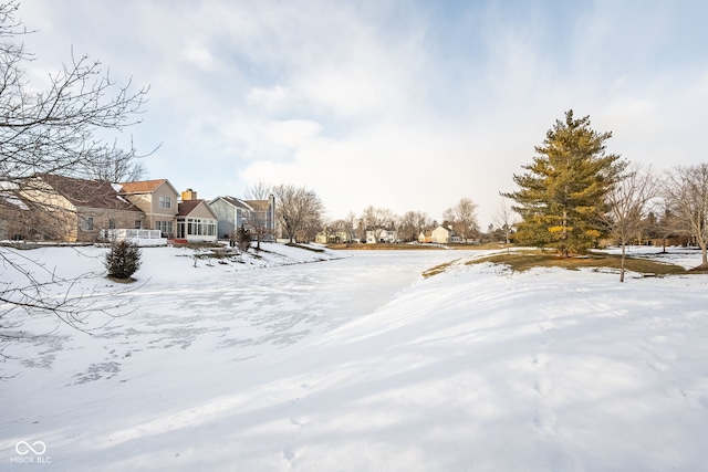 view of yard covered in snow