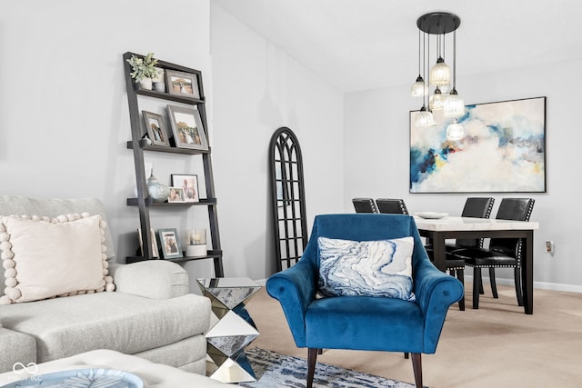 living area featuring light colored carpet