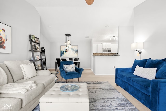 living room featuring light colored carpet