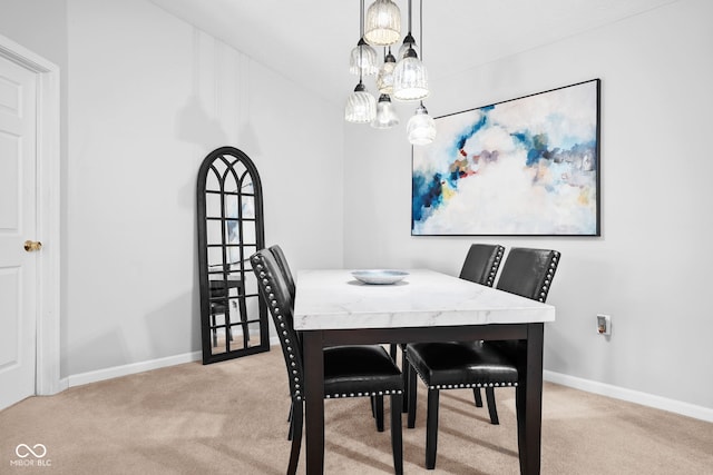 view of carpeted dining space