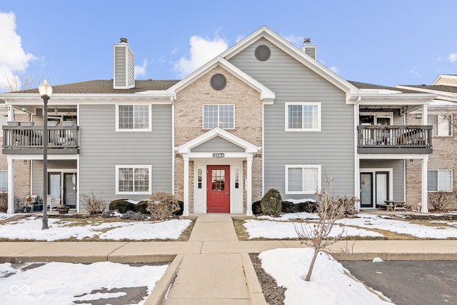 townhome / multi-family property featuring a balcony