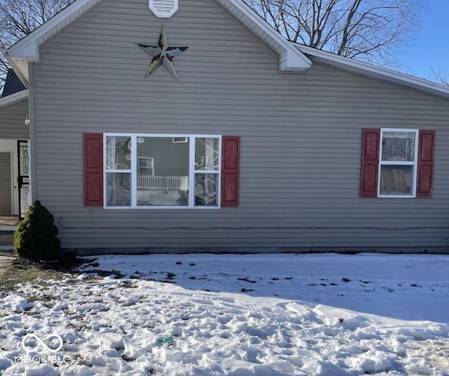 view of snow covered property