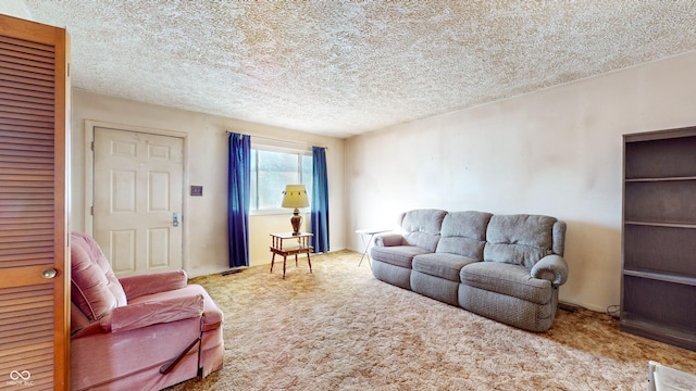 living room featuring a textured ceiling and carpet flooring