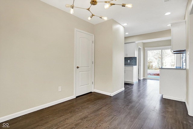 interior space with dark wood-style floors, recessed lighting, and baseboards