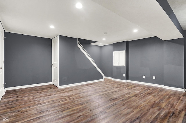 finished basement with recessed lighting, wood finished floors, and baseboards