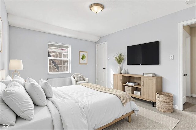 carpeted bedroom with visible vents and baseboards