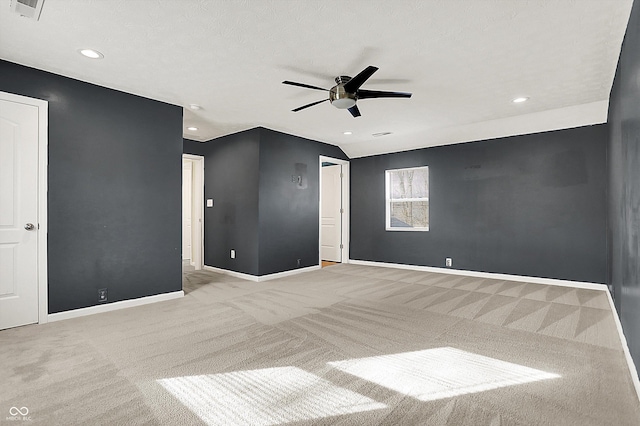 empty room featuring ceiling fan, visible vents, baseboards, and carpet flooring