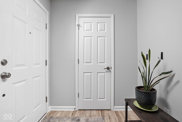 foyer entrance with light wood-type flooring