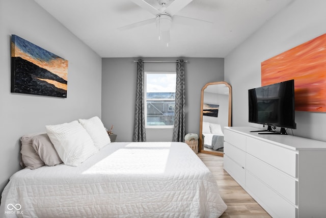 bedroom featuring light hardwood / wood-style floors and ceiling fan