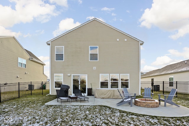 back of property featuring a patio area and an outdoor fire pit