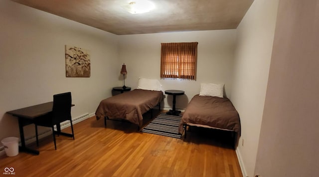 bedroom with hardwood / wood-style flooring