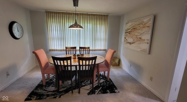 view of carpeted dining area