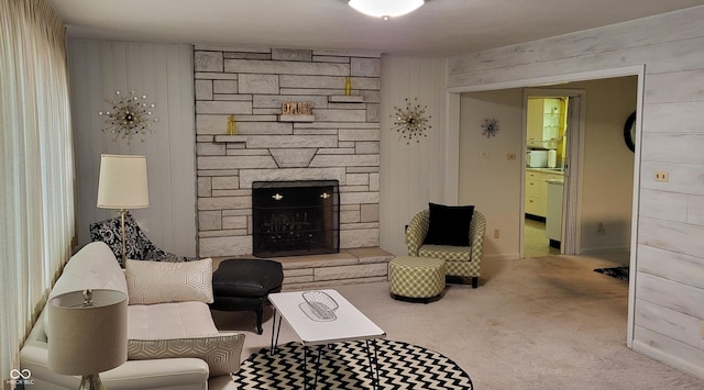 carpeted living room featuring a fireplace