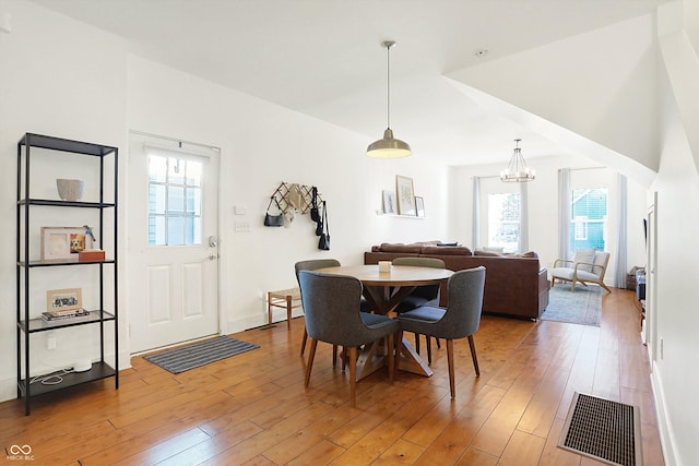 dining space featuring hardwood / wood-style flooring