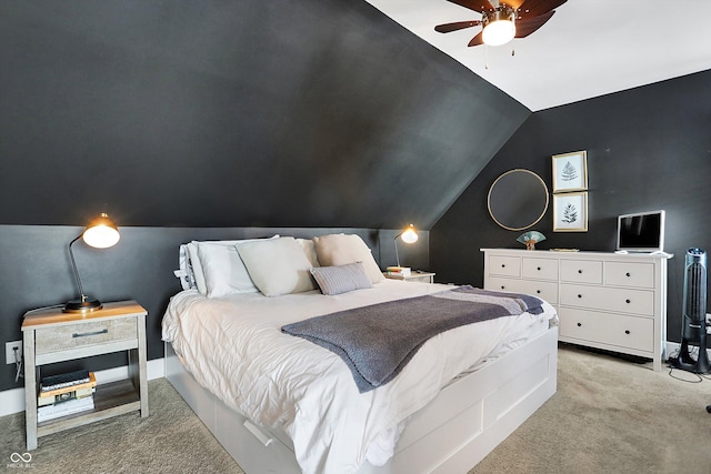 bedroom with lofted ceiling and light carpet