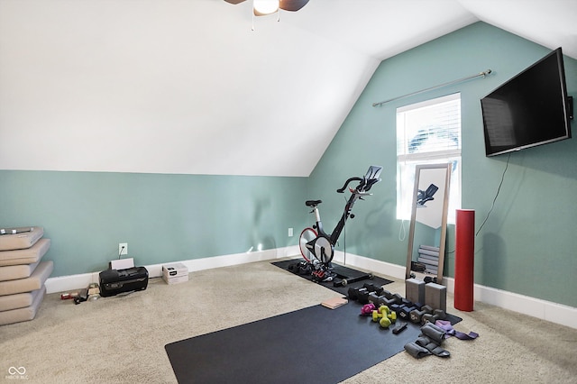 workout room featuring vaulted ceiling, ceiling fan, and carpet flooring