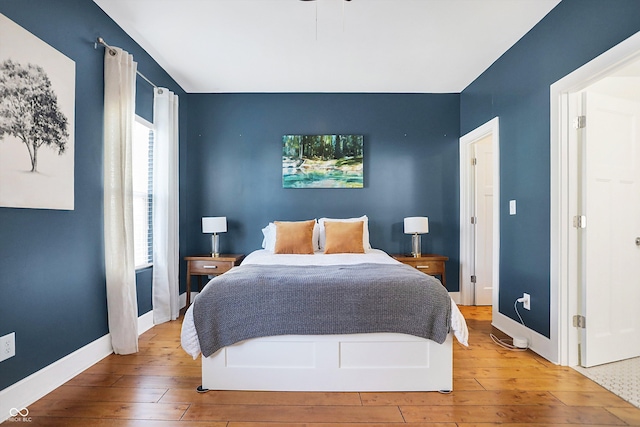 bedroom with hardwood / wood-style flooring