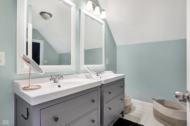 bathroom featuring vanity and vaulted ceiling