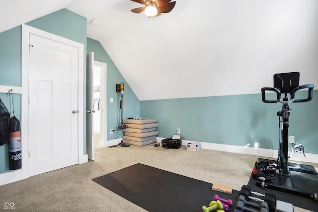 workout room with ceiling fan, lofted ceiling, and carpet floors