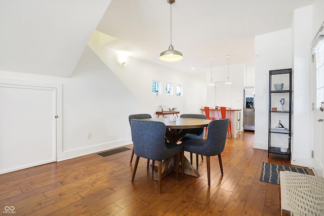 dining room featuring dark wood-type flooring