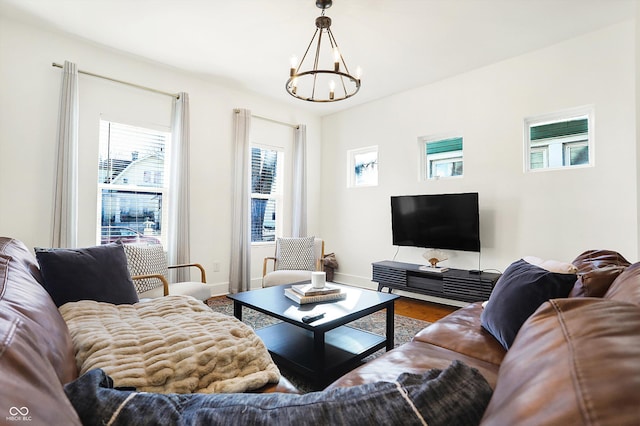 living room featuring a chandelier and hardwood / wood-style floors