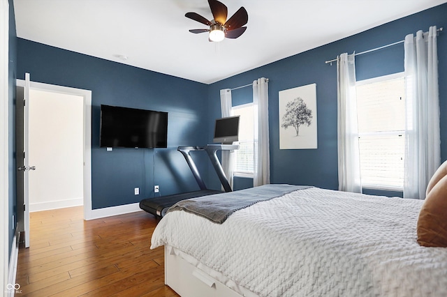 bedroom featuring hardwood / wood-style flooring and ceiling fan