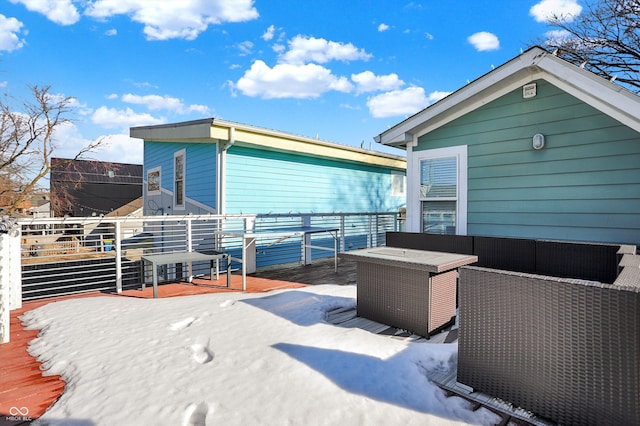 rear view of property with a wooden deck