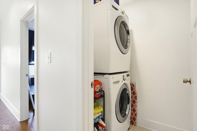 laundry room with stacked washer and dryer