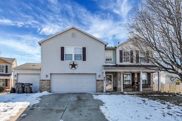 front of property with a garage and covered porch