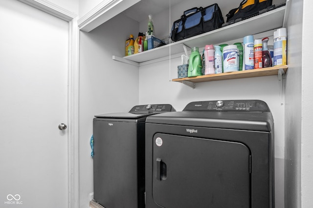 clothes washing area with washer and dryer